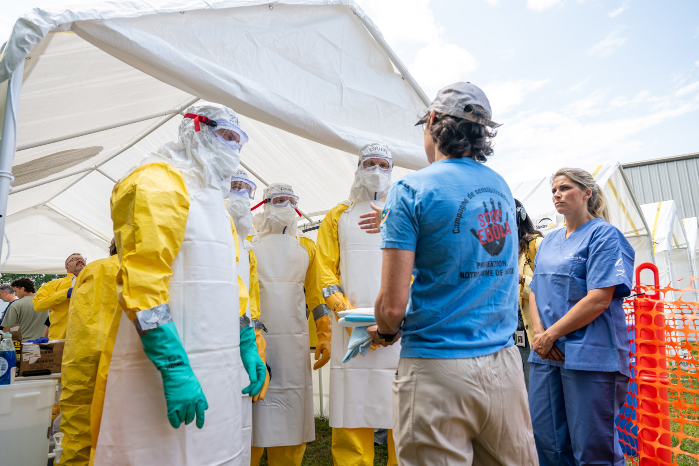Bev Kauffeldt leading Kristy Graham and a group of DART members through Ebola training