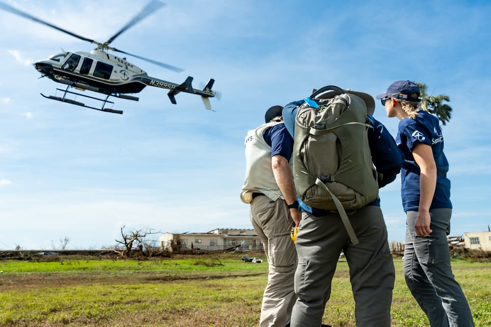 Samaritan’s Purse helicopter taking off to deliver aid to remote hurricane-affected areas in Jamaica.