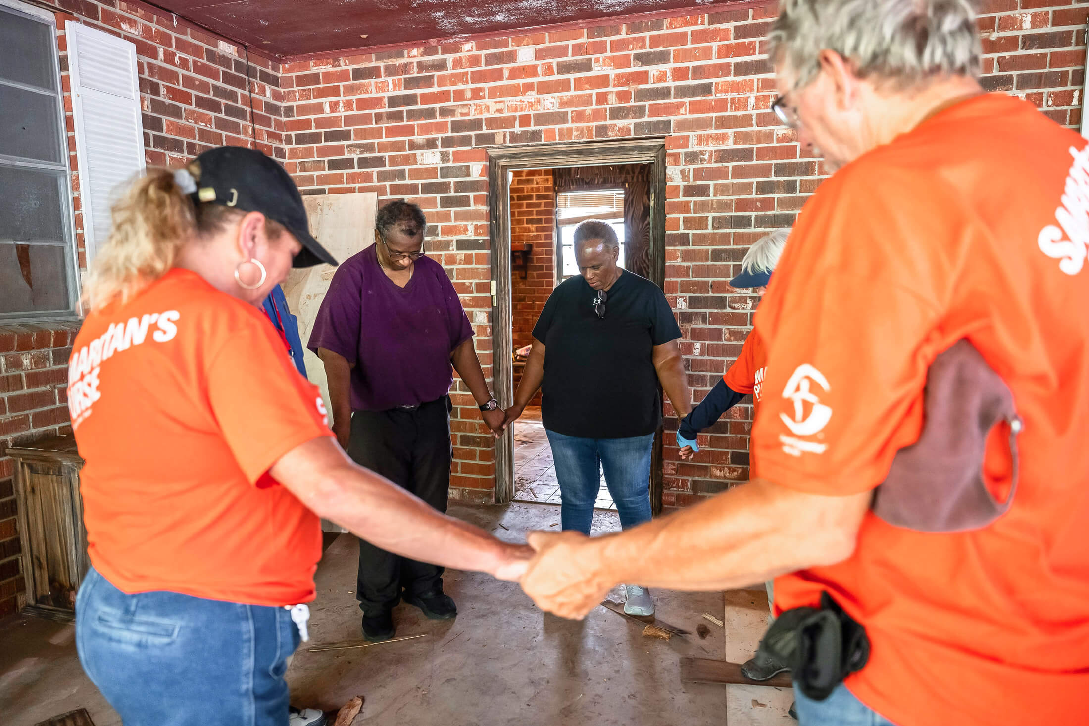our teams distribute tarps, water, solar lights, blankets, and other items