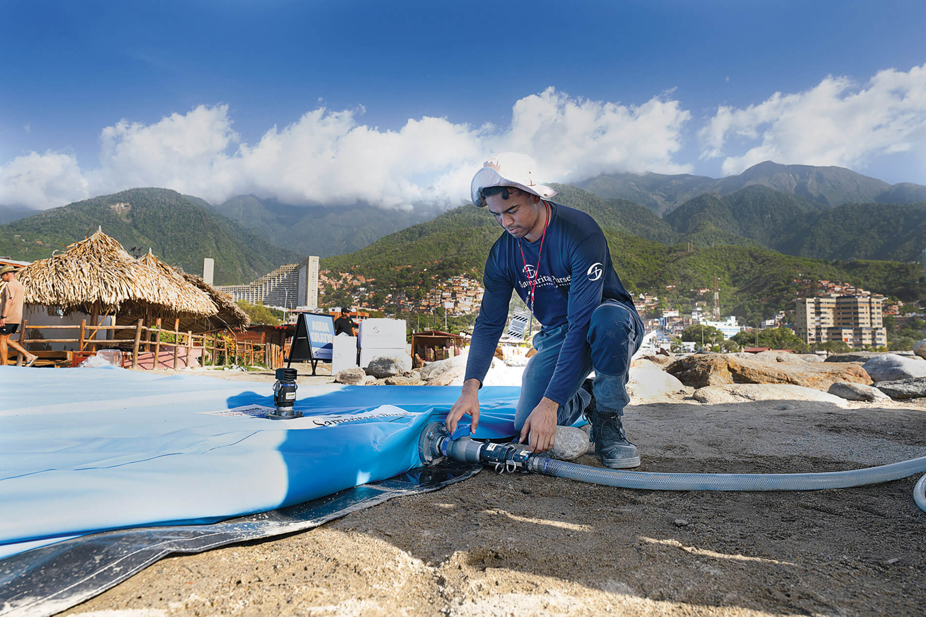 our teams distribute tarps, water, solar lights, blankets, and other items