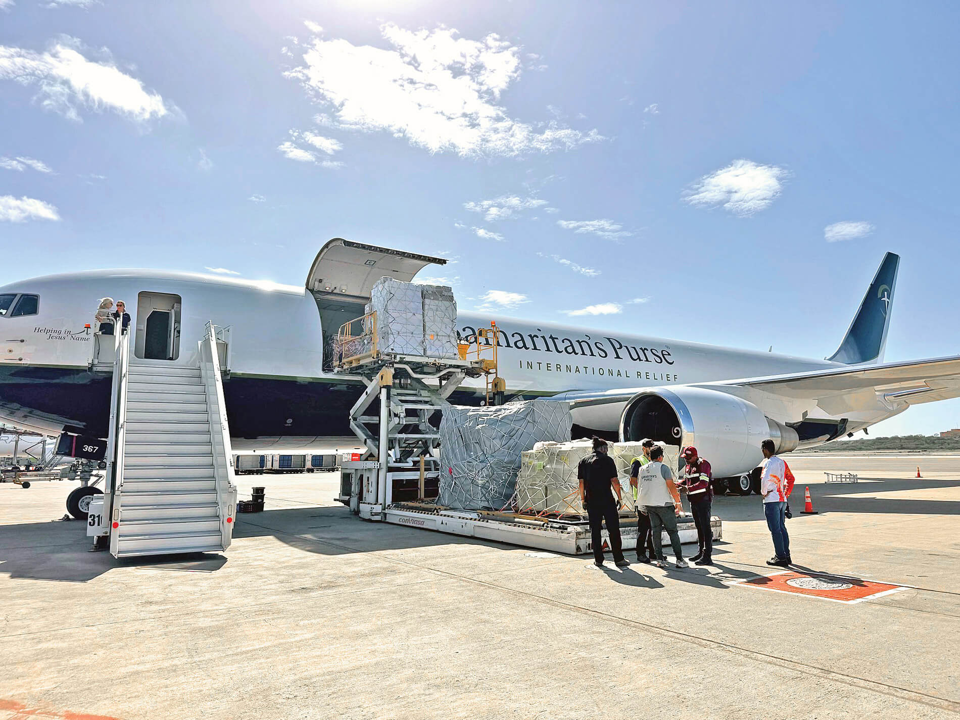hospital and medical supplies being unloaded from the Samaritan's Purse 767