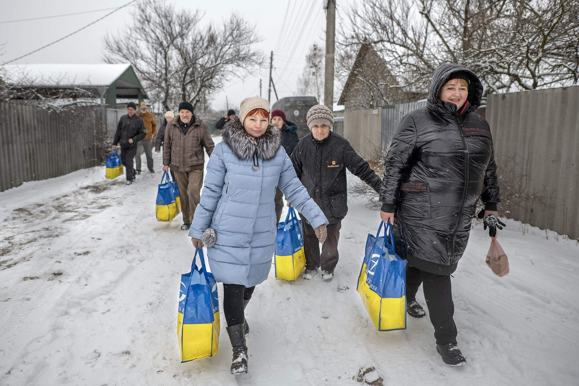 Ukrainians with supply bags provided by Samaritan's Purse