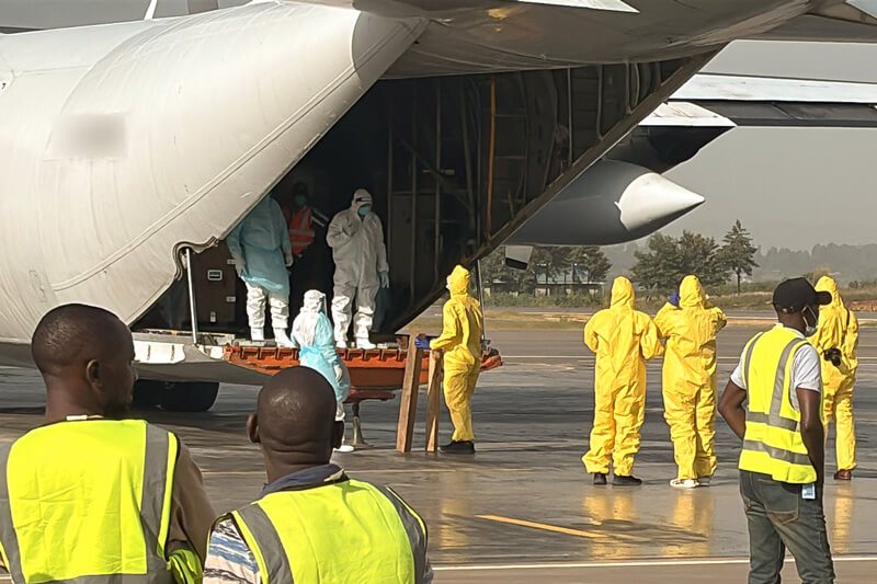 Workers in PPE unloading the Samaritan's Purse 767 airplane