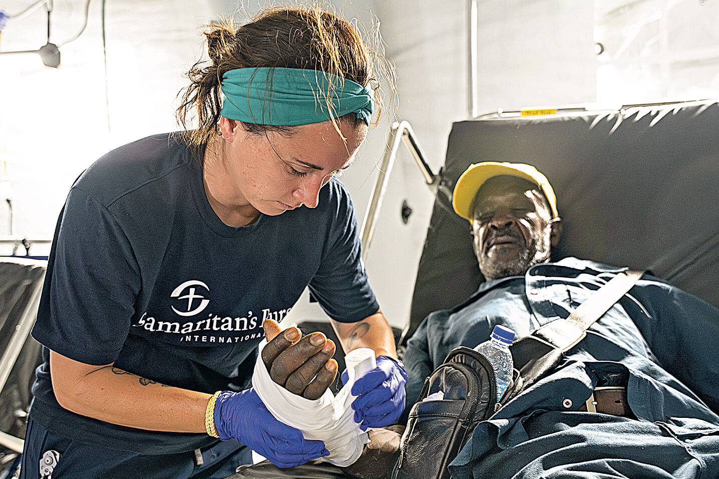 Samaritan's Purse staff helping a patient.