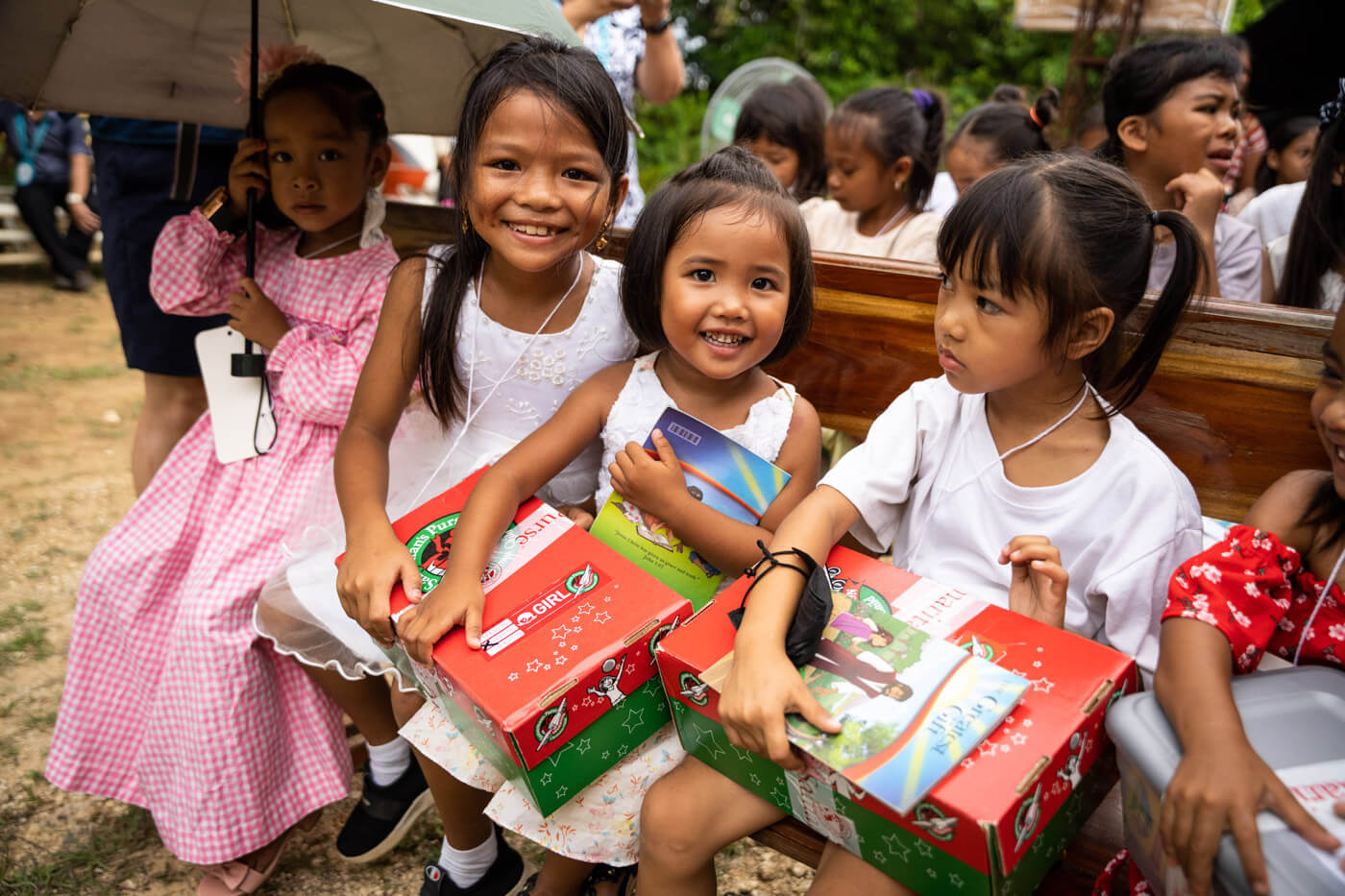 Children with Operation Christmas Child shoeboxes.