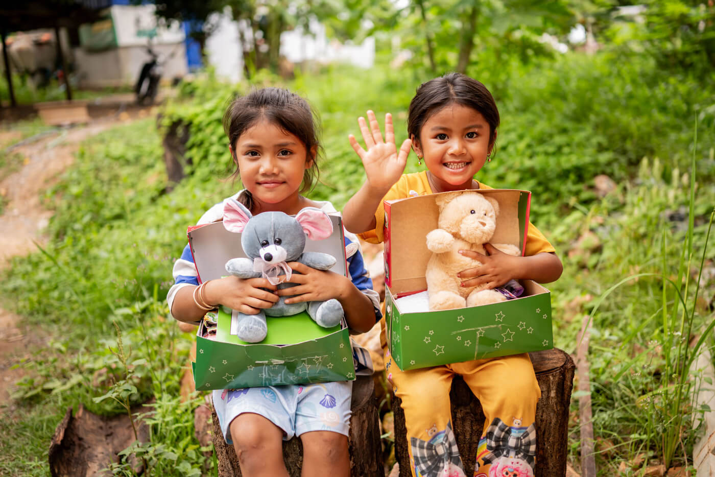 two girls with their shoebox gifts in Cambodia