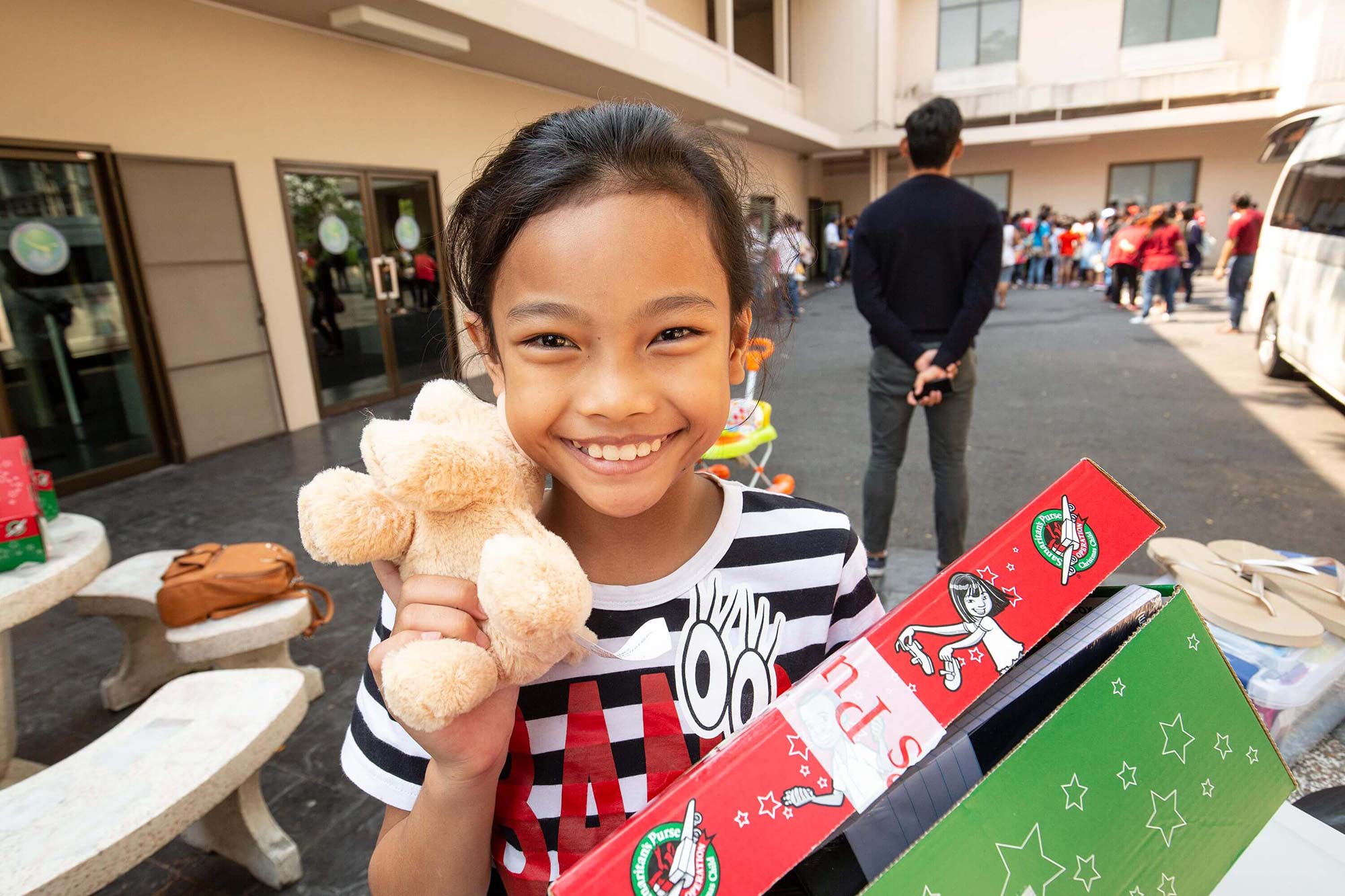 a girl showing off her gift