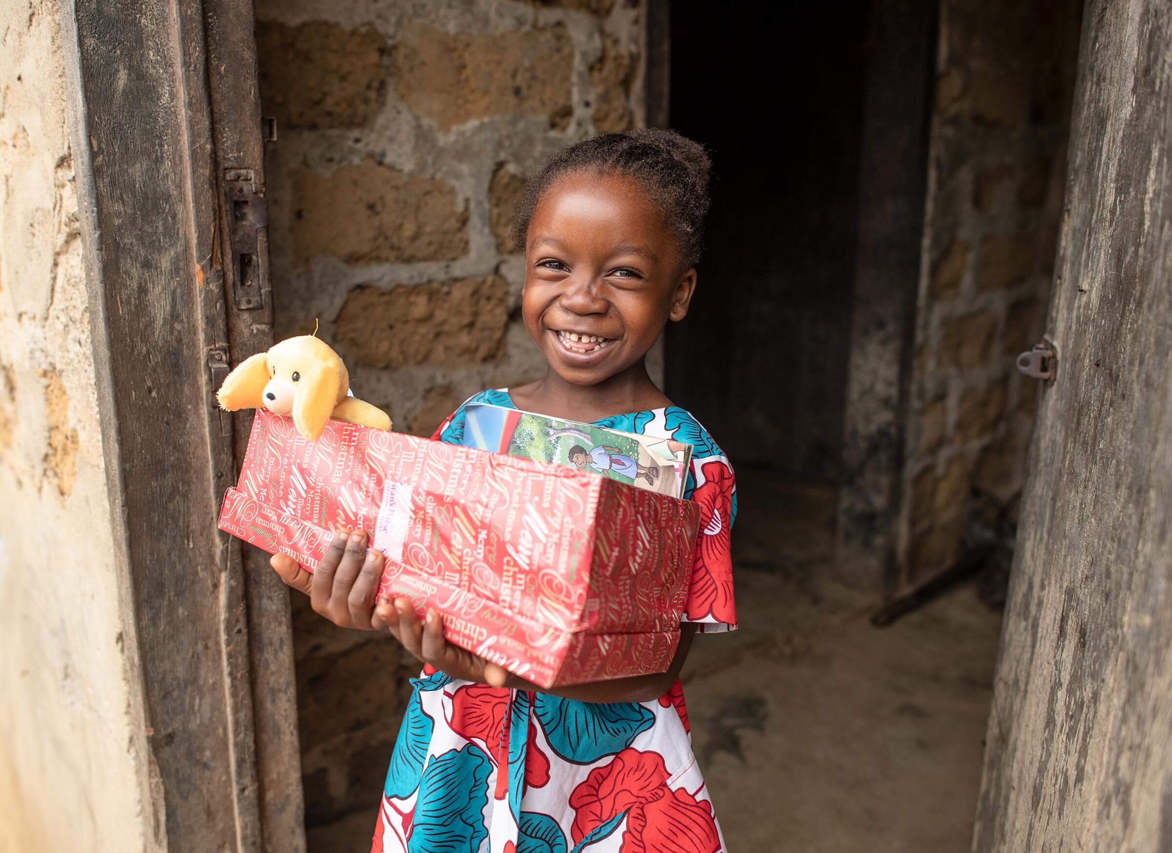 a girl in Liberia with her shoebox