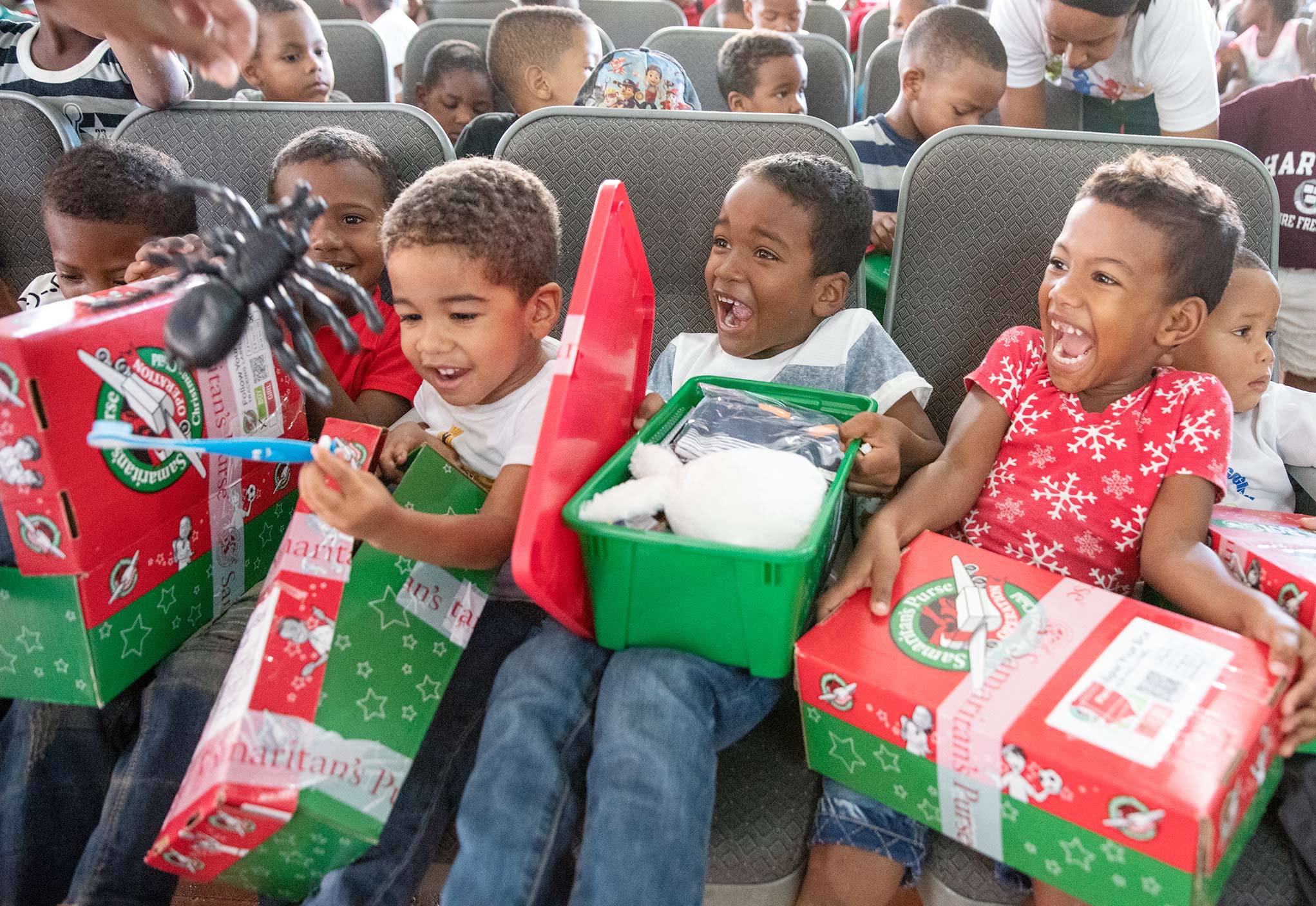 children opening their shoebox gifts