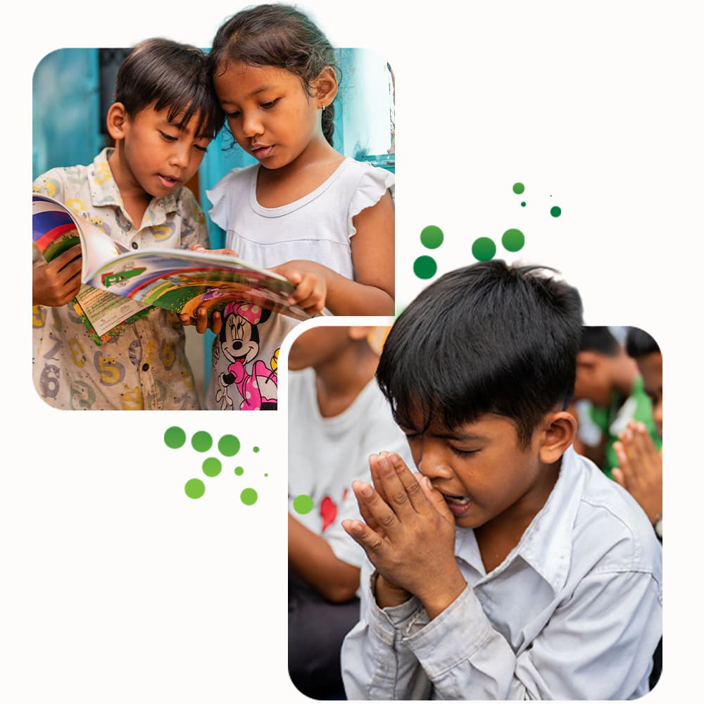 Two children reading together while another child prays