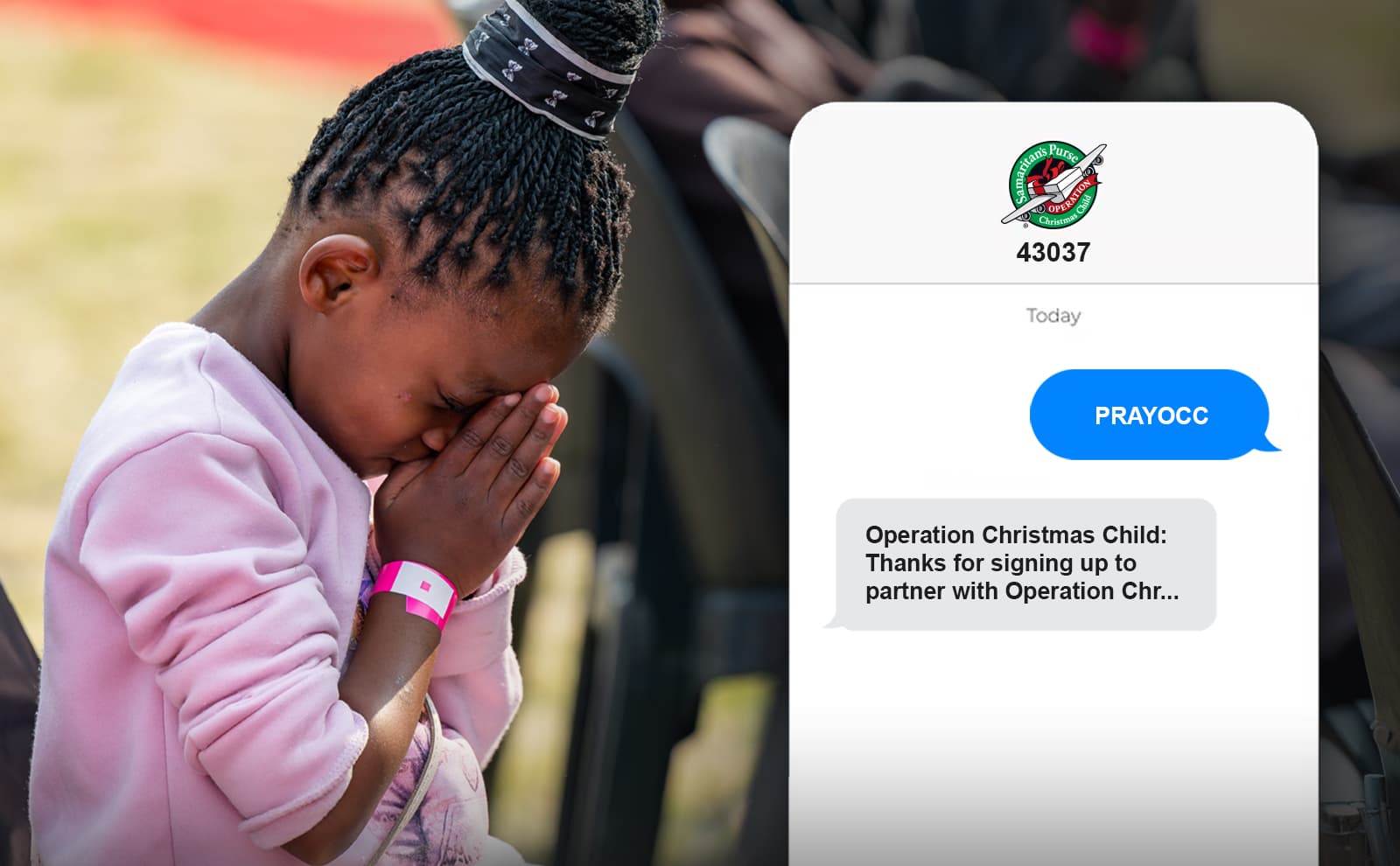 A child praying beside a phone showing the PRAYOCC text keyword