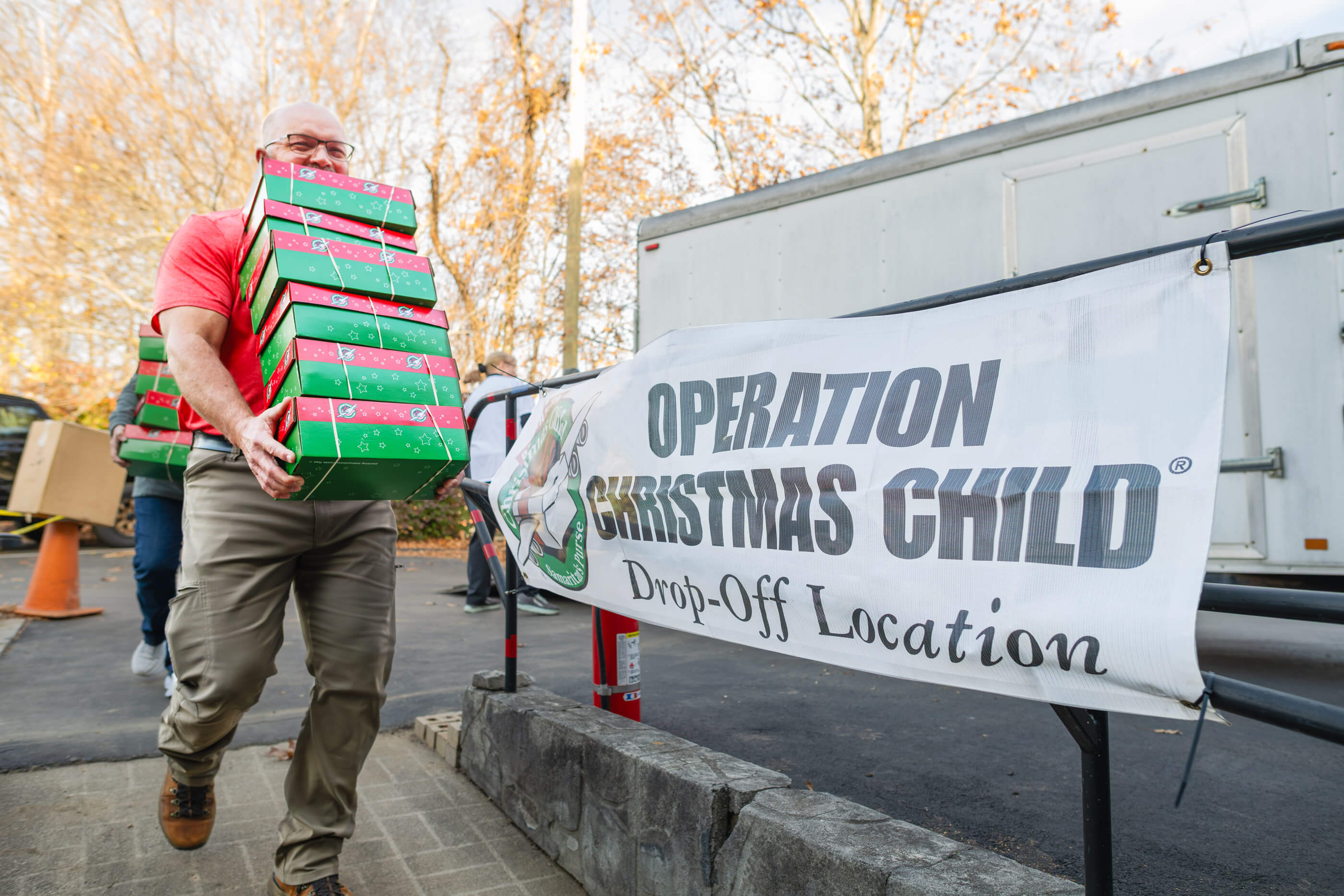 Aerial view of the destruction left from Hurricane Melissa in a Jamaican neighborhood with rooftops torn from homes and debris scattered around the homes and streets